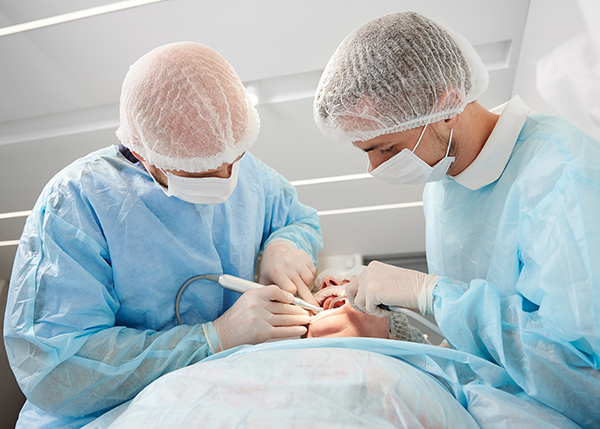 Close-up Dental Surgery Process. Implantation. Dentist Surgeon W